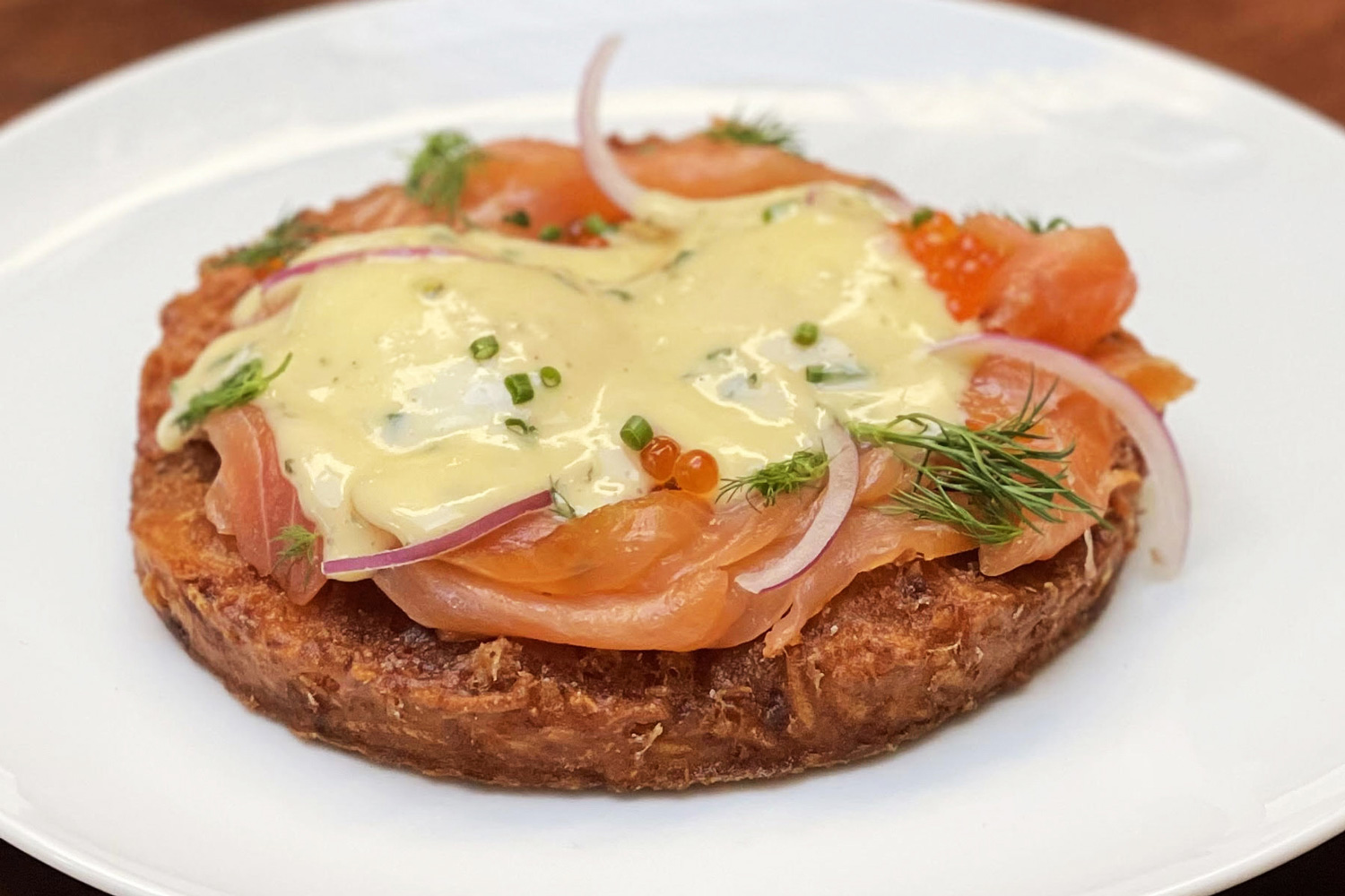 image of republique's potato pancake topped with lox, eggs, and hollandaise