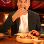 Image of Phil Rosenthal trying some appetizers at Republique restaurant in Los Angeles