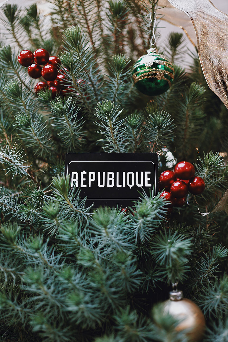 christmas wreath with republique gift card tucked in the center